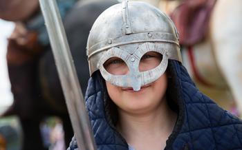 Boy with an iron sword in Medieval cosplay