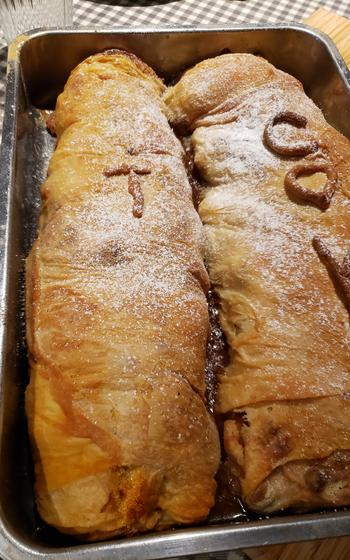 Two baked strudels side-by-side in a pan