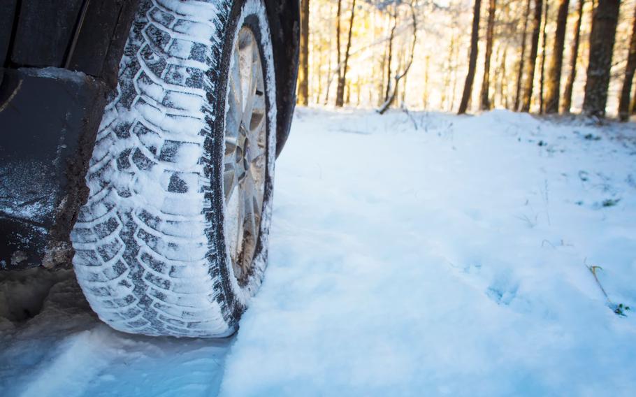 Winter tires on a snow covered road