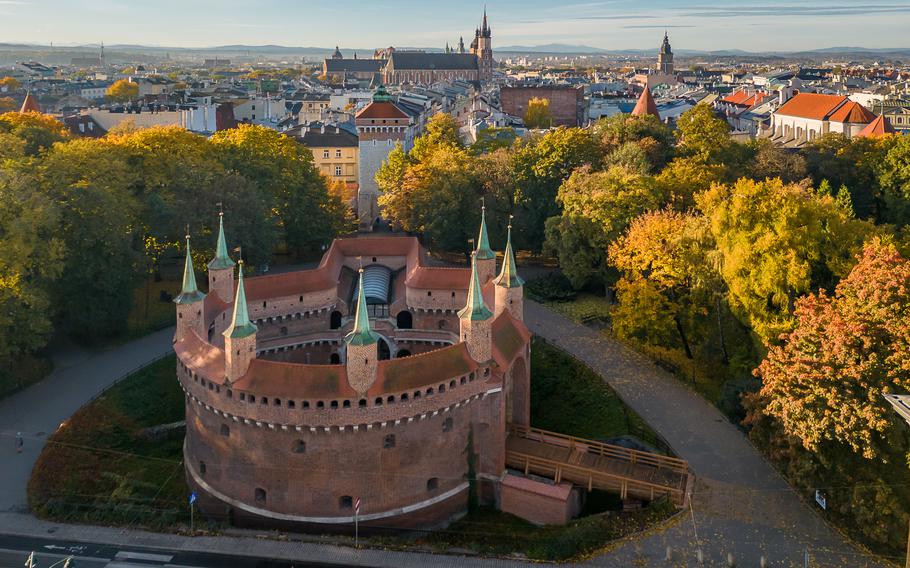 Barbicane (Barbakan), part of medieval gothic city fortification in the sunny autumn morning, aerial view, Krakow, Poland