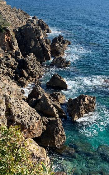 Rocky shoreline of the Stoupa Bike Path
