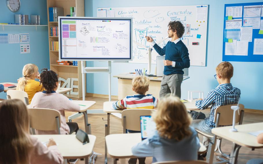 teacher using digital white board