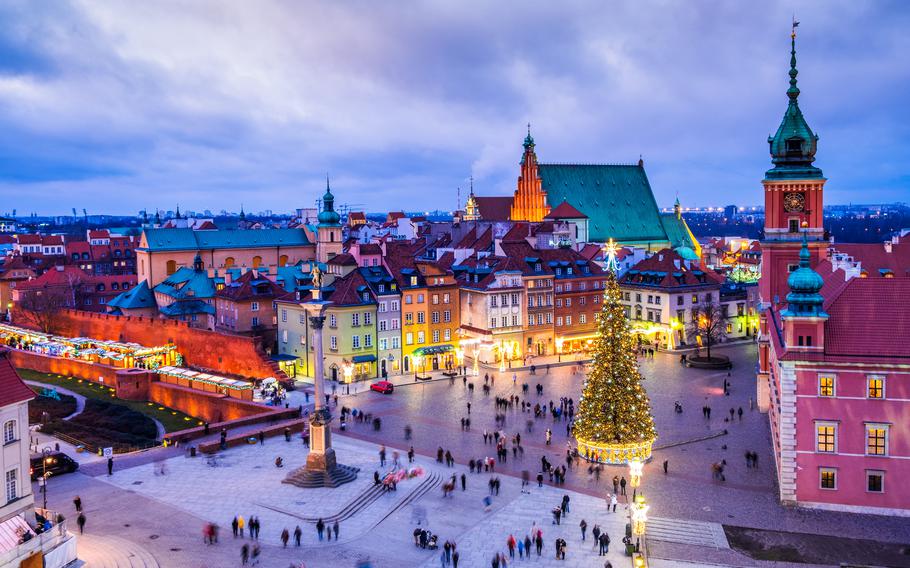 Warsaw, Poland - Night scene with Christmas tree in Castle Square old town.