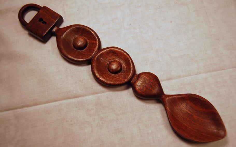 A hand carved wooden love spoon from Wales.  Traditionally given from one lover to another as a token of appreciation.