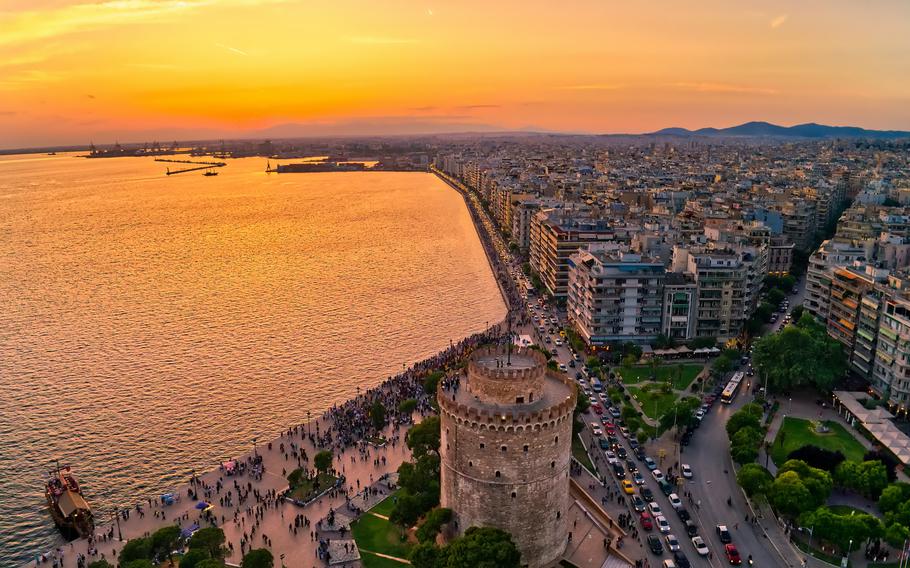 Aerial view of famous White Tower of Thessaloniki at sunset, Greece. Image taken with action drone camera. 