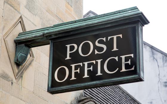 Post Office Sign on Stone Facade