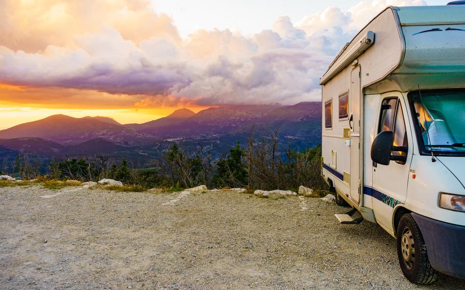 Caravan rv at sunset in mountains. Verdon Gorge in France. a yellow sky with purple mountains. 