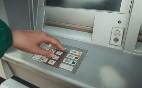 Photo Of Hand pushing buttons at the ATM