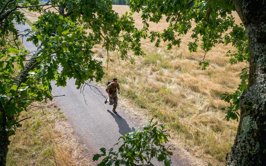 U.S. Air Force Staff Sgt. Joseph Niccum, U.S. Air Forces in Europe – Air Forces Africa terminal instrument procedure designer, rucks 12 kilometers (7 miles) at Ramstein Air Base, Germany, July 13, 2023. The ruck was part of a series of exercises U.S. military personnel were required to complete to qualify for the German Armed Forces Proficiency Badge.