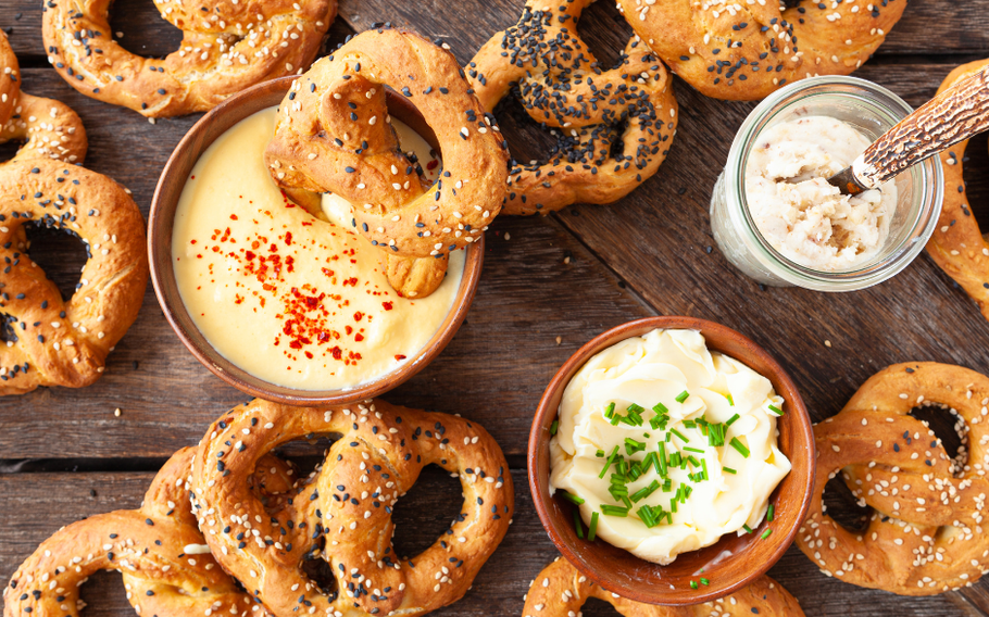 Differently topped pretzels with dips