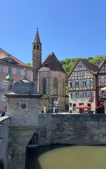 Exterior shot of town and body of water on a sunny day