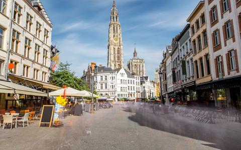 Photo Of Antwerp City Center on a sunny days with white buildings on both sides.