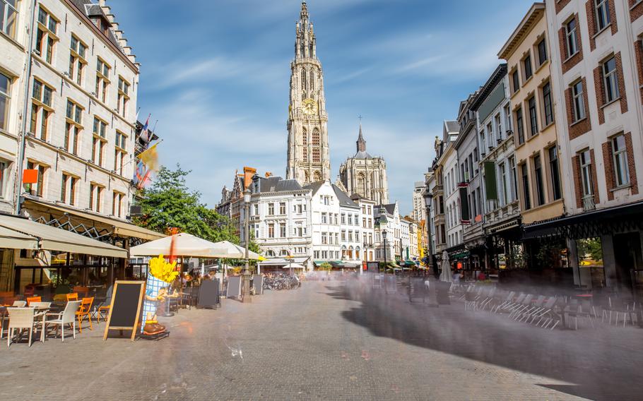 Antwerp City Center on a sunny days with white buildings on both sides.