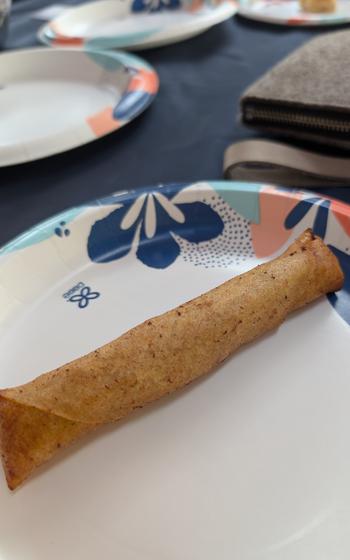 Completed rolled lumpia on a disposable plate