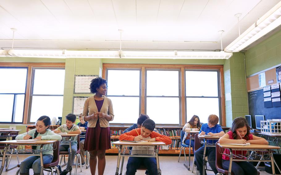 A teacher in a classroom with her students