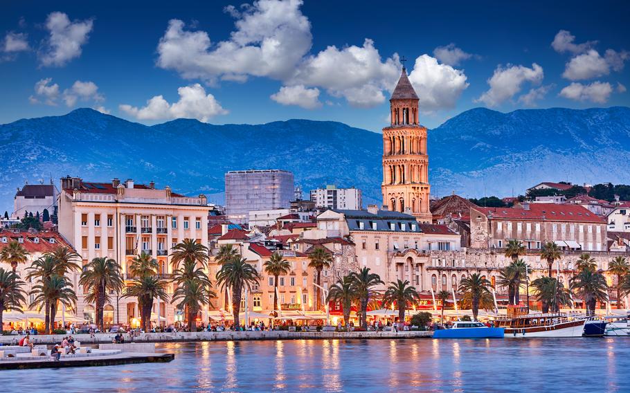 View of Split - the second largest city of Croatia at night. Shore of the Adriatic Sea and famous Palace of the Emperor Diocletian.