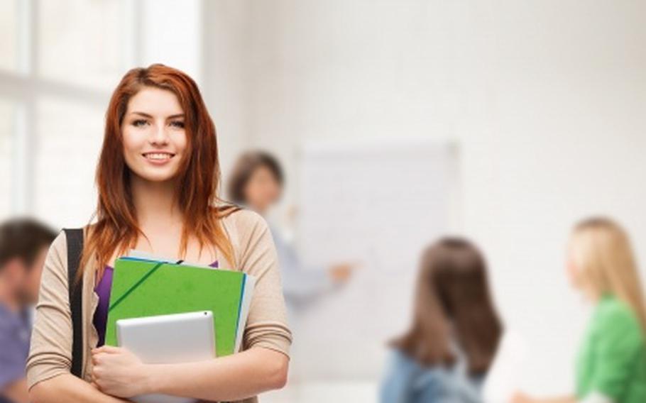 Student holding textbook