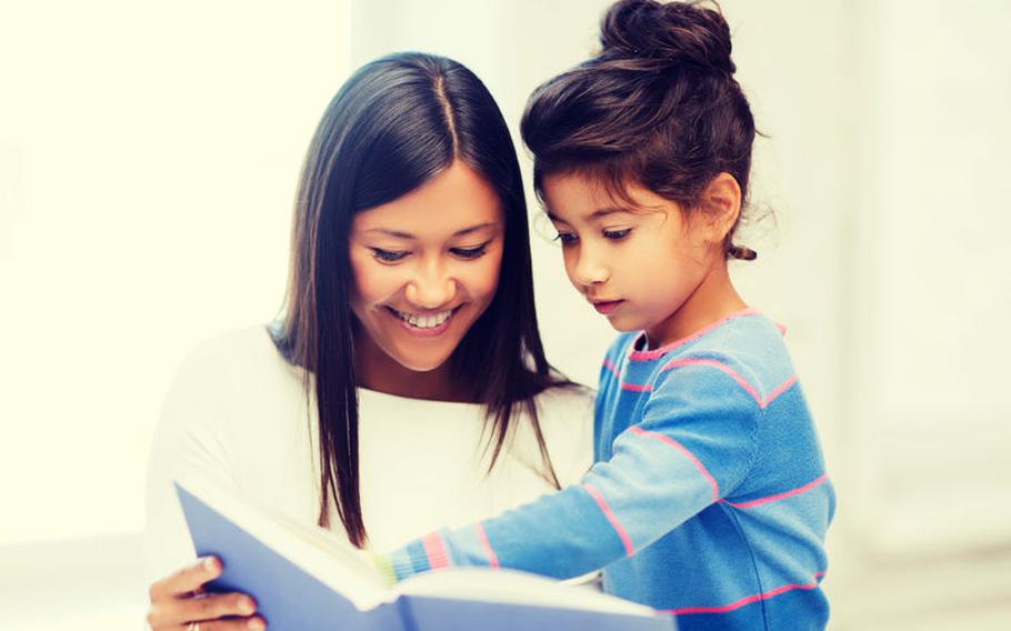 Adult reading to child