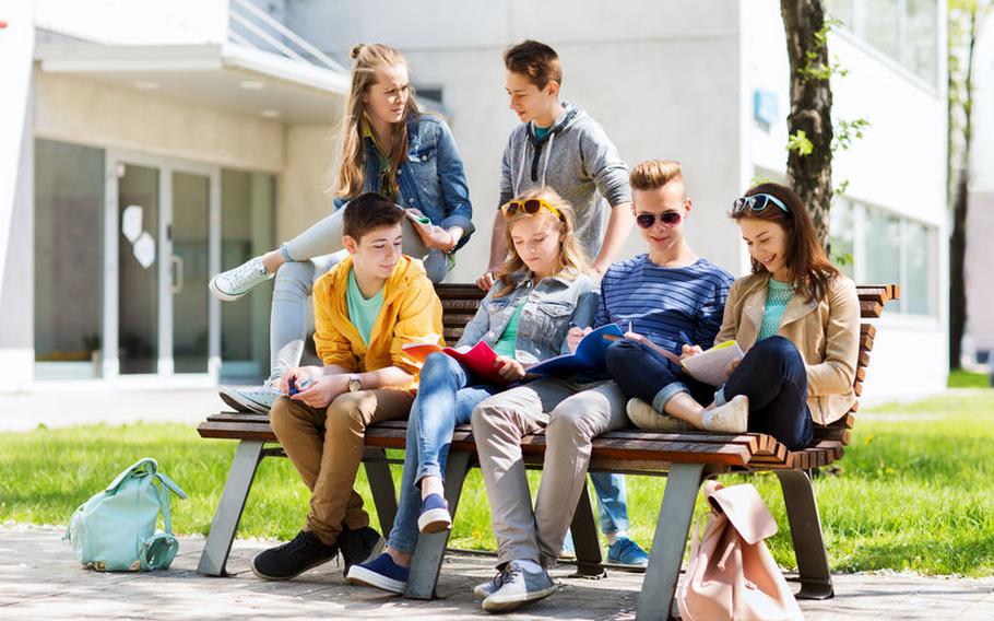 Teenagers outside on bench