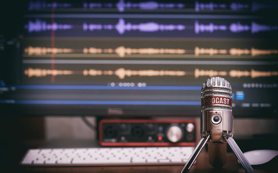 Microphone with a podcast icon on a table