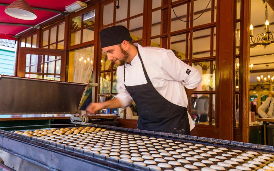 Chef making pancakes on griddle