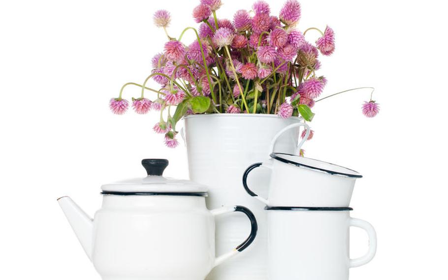 Teapot and cups and flowers