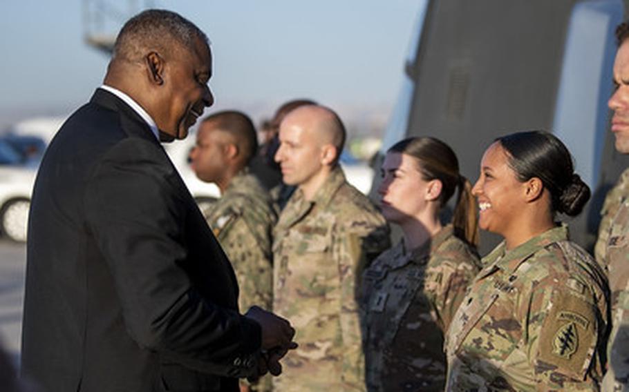 Secretary of Defense Lloyd J. Austin III presents coins to coalition troops representing Combined Joint Task Force – Operation Inherent Resolve while visiting Erbil, Iraq, March 7, 2023. (DoD photo by U.S. Navy Petty Officer 2nd Class Alexander Kubitza)
