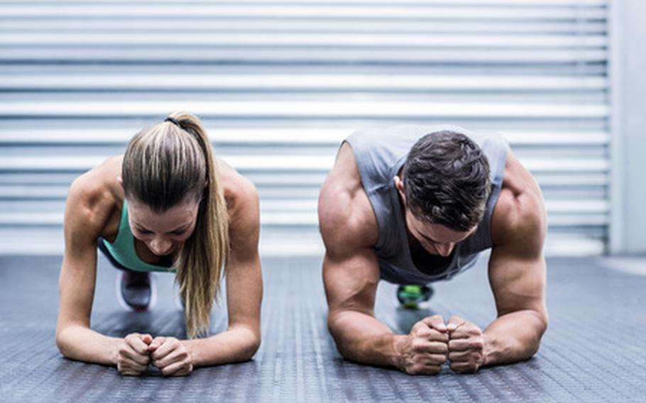 Two people in plank position