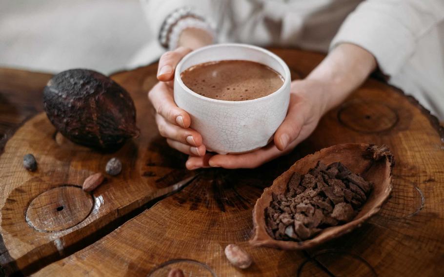 traditional chocolate drink and cacao pod