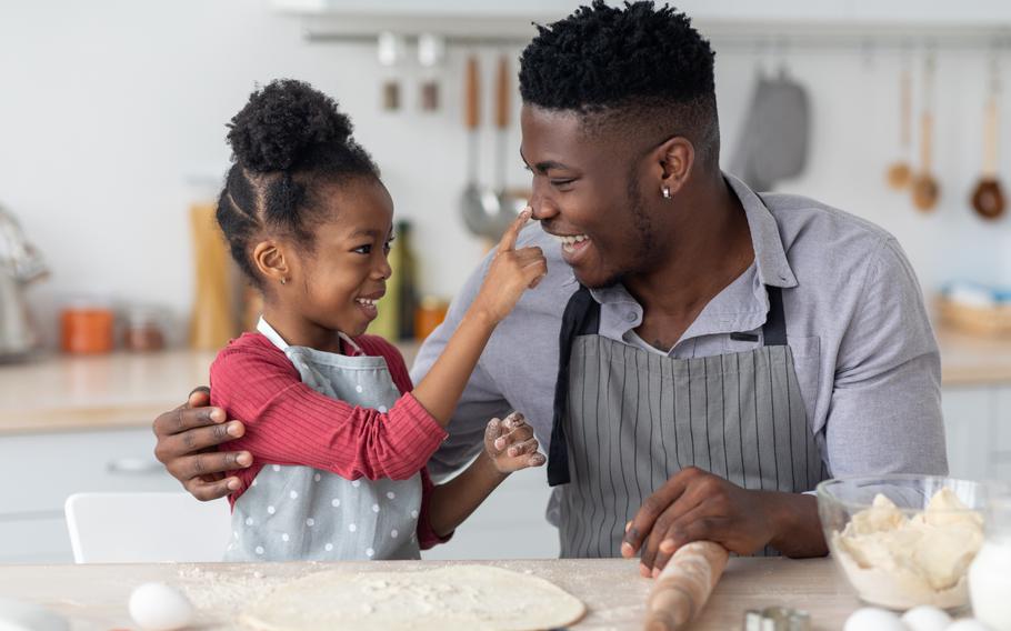 Dad and daughter in kitchen