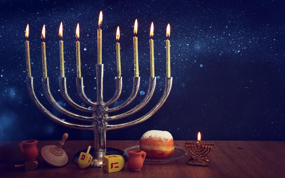 Menorah (traditional Candelabra), donut and wooden dreidel (spinning top)