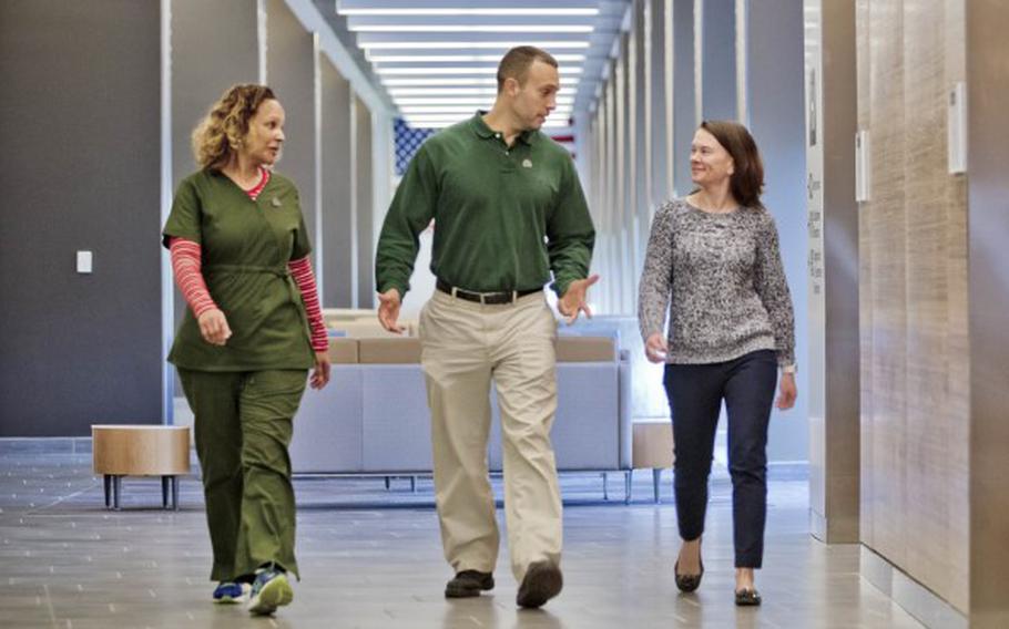 People walking in hallway