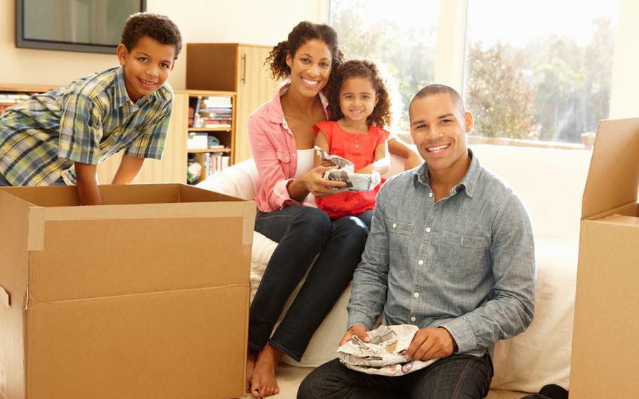 Family with moving boxes