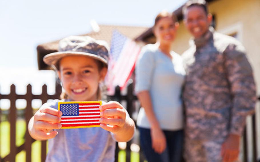 Military child holding flag