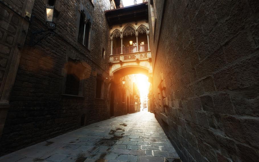 Gothic Quarter and Bridge of Sighs during sunrise in Barcelona, ​​Catalonia, Spain | Photo via 123RF