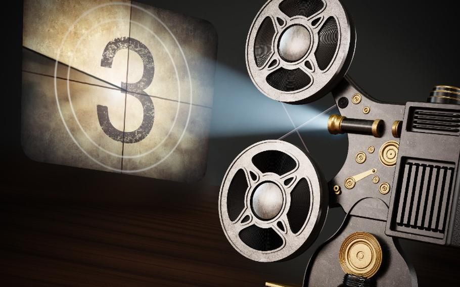 Vintage movie projector projects countdown screen.