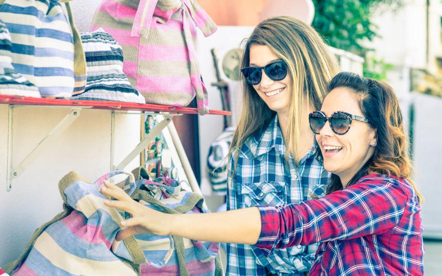 Two women shopping at flea market