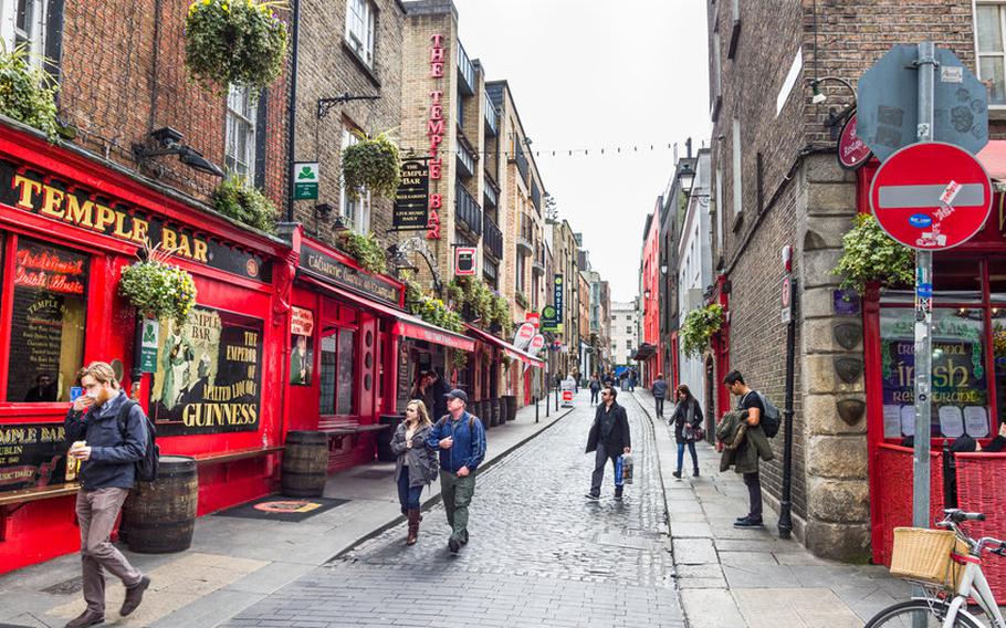 Tourists walking on a street in Dublin