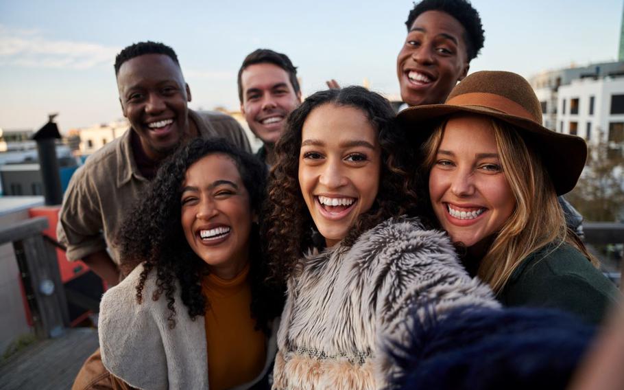 Group of six friends taking selfie