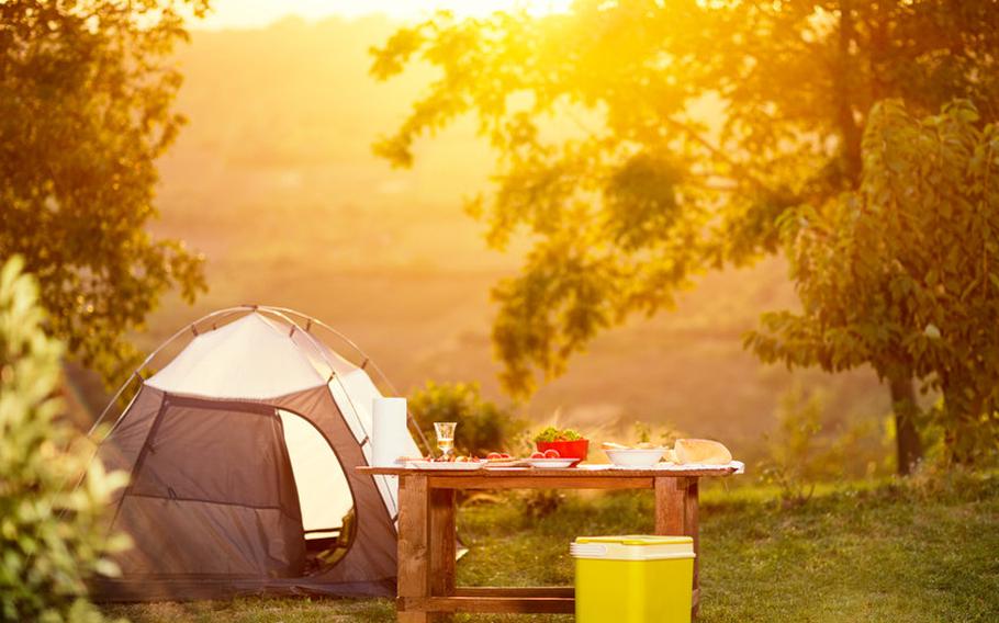 Tent and other camping materials in sunset