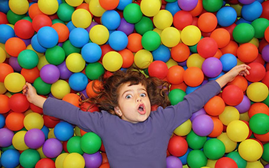 child in ball pit