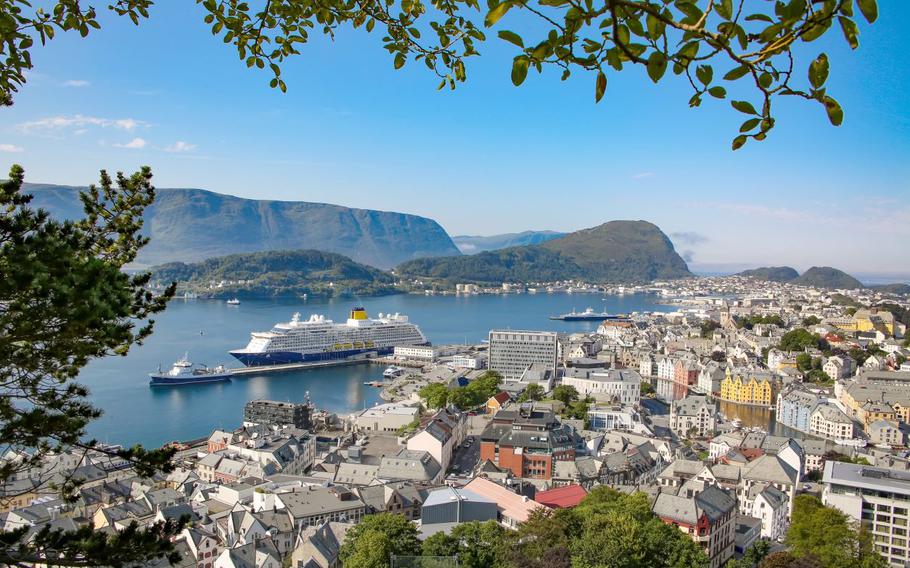 Cruise ship on water and houses in Aksla, Alesund, Norway