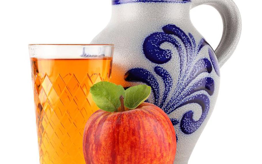 Apple, glass of apple juice and bembel