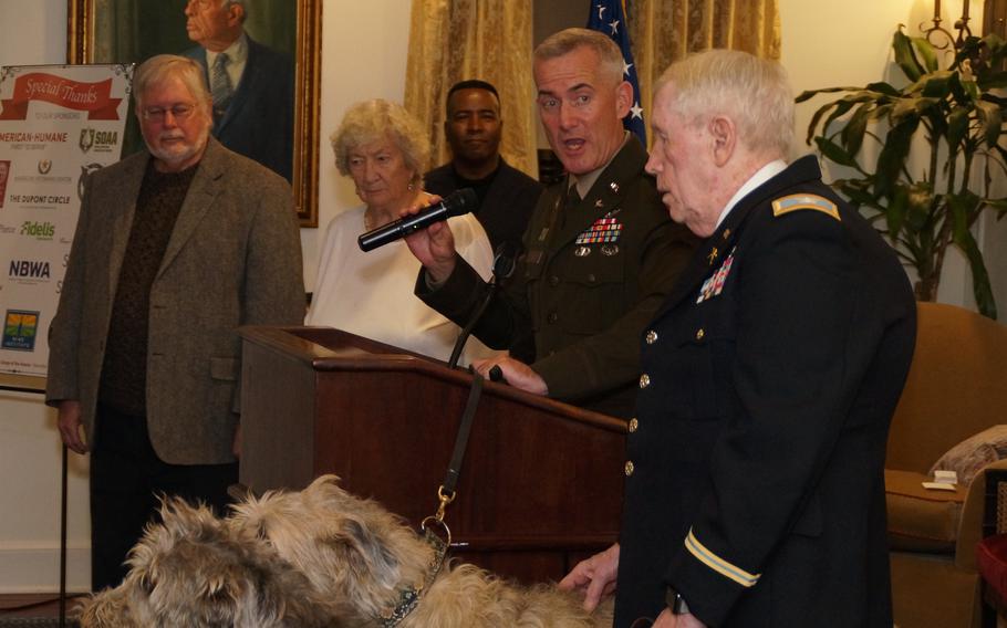 Colonel James Tierney, of the famed "Fighting 69th" Army Regiment and others including Wolfhounds Rosie and Ivy lead the Regimental Toast to all US troops serving worldwide | Photo by Miguel Leonardo