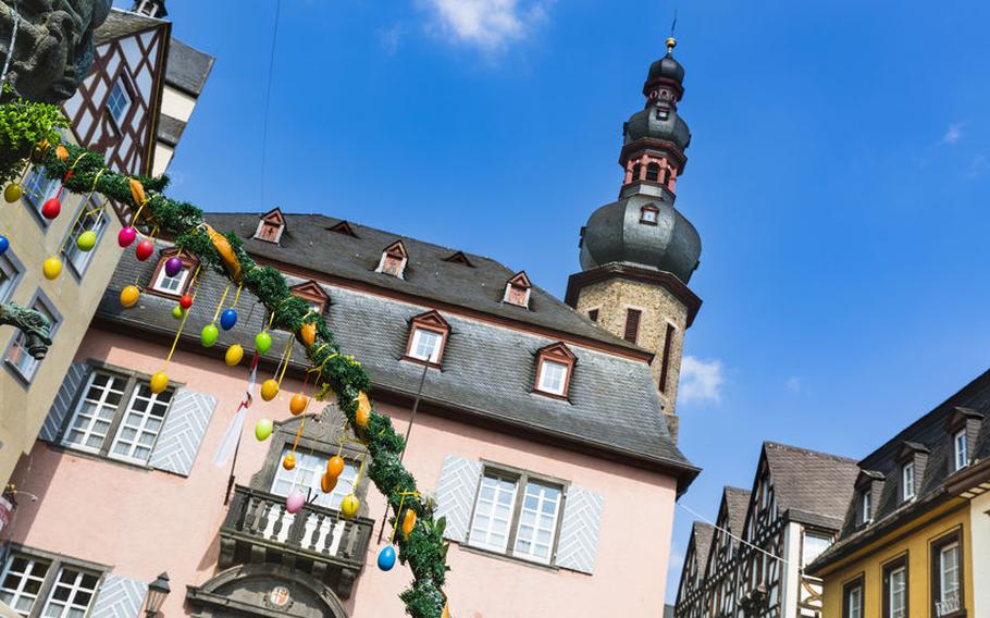 The town hall of Cochem in the Moselle Valley, Germany with some Easter egg decoration in the foreground.