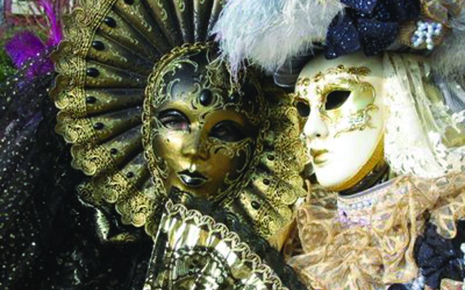 People wearing Carnival masks