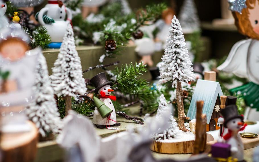 Snowmen and other Christmas-related items on a table